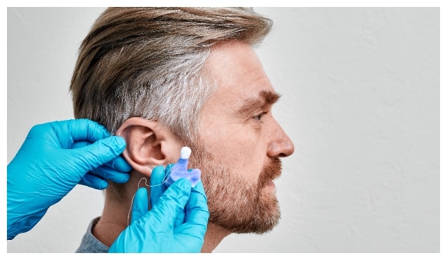 Man getting custom made hearing protections from his local audiologists in IL